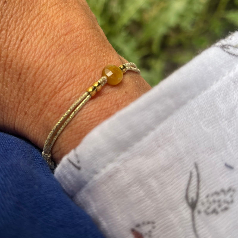 Bracelet élastique Félicité sphère bisauté oeil de tigre doré