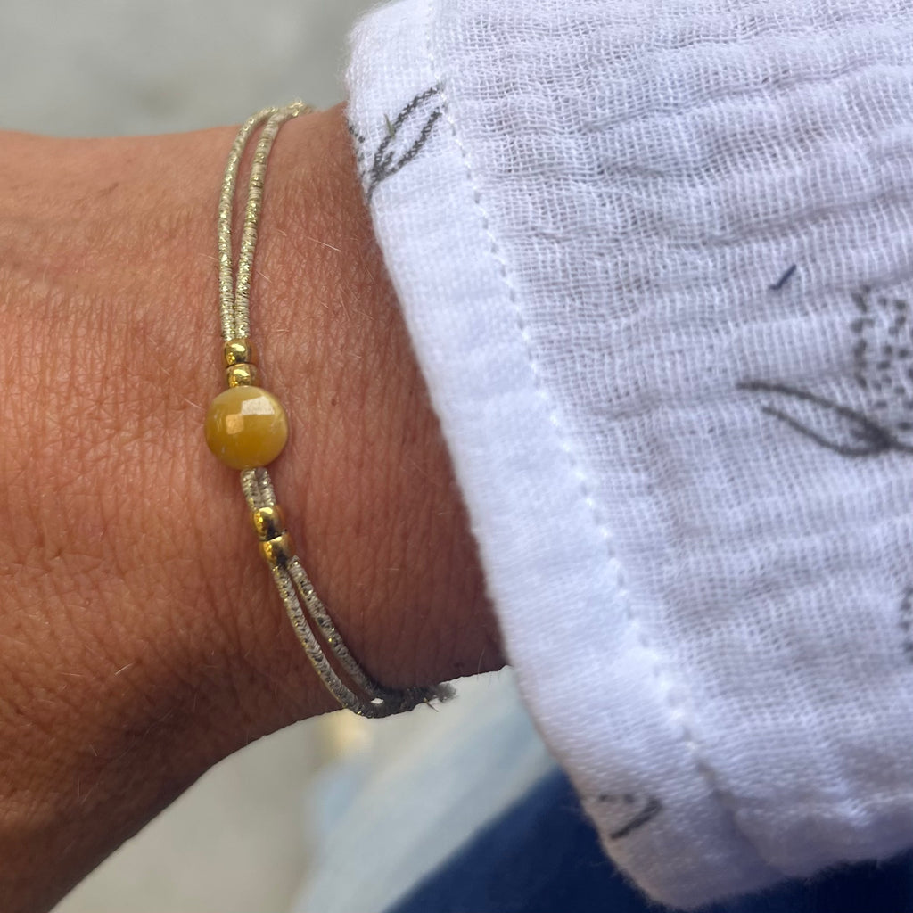 Bracelet élastique Félicité sphère bisauté oeil de tigre doré